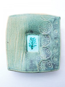 Porcelain dropped plate with celadon and copper reduction glaze