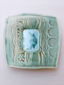 Porcelain dropped plate with celadon and copper reduction glaze