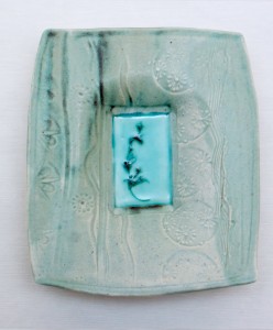 Stoneware dropped plate with duck egg shino and copper glaze