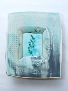 Porcelain dropped plate with celadon and copper reduction glaze