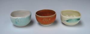 3 small porcelain bowls.