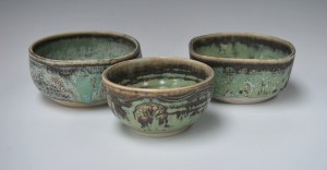 3 small porcelain bowls.
